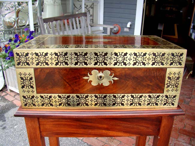 A wonderful English Regency period brass inlaid mahogany writing box circa 1820 on later stand